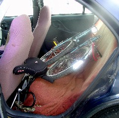 The entire bike fits easily into the rear seat of a small four-door car.