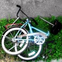 Portable bike folded and ready for transport.