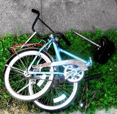 Portable bike folded and ready for transport.