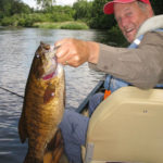 Client holding a big smallmouth bass