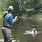 Tim with a jumping smallie on the line