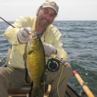 Tim in a canoe with a big smallie