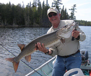 Dan Johnson holding a huge muskie