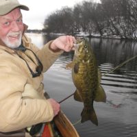 Dan Johnson in winter with a big smallmouth