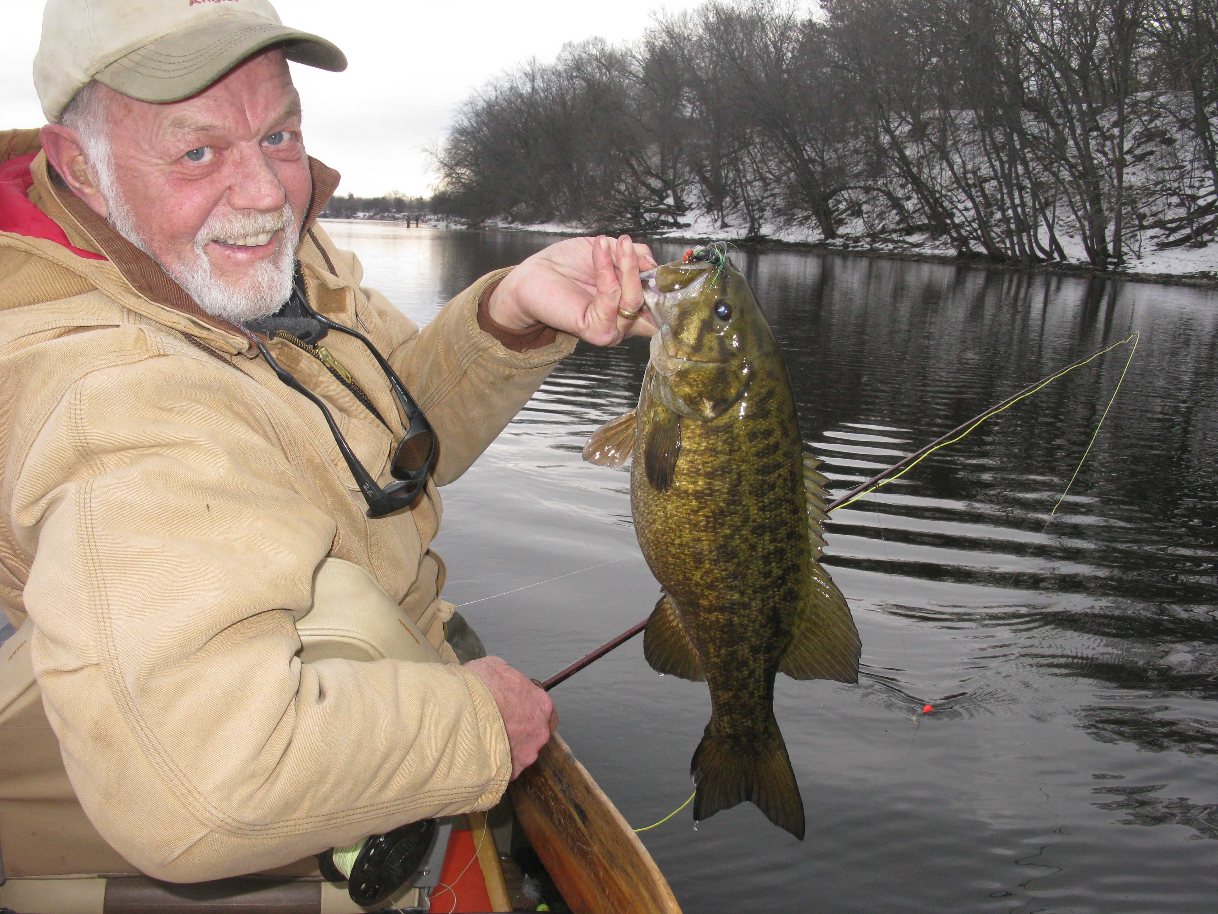 Dan Johnson in winter with a big smallmouth