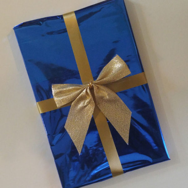 This book, gift-wrapped in blue foil with gold ribbon